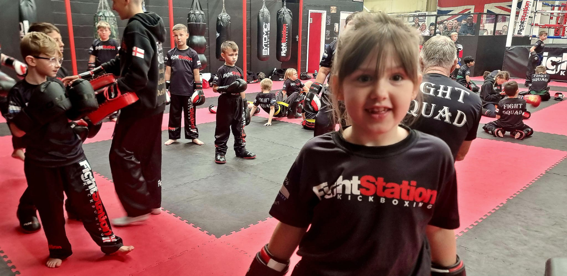 Members and coaches on the mats at Fight Station Kickboxing